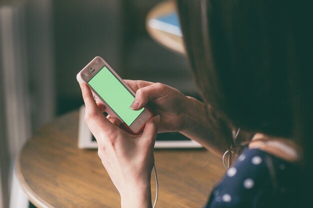 close-up-woman-touching-her-mobile-s-screen_1153-19