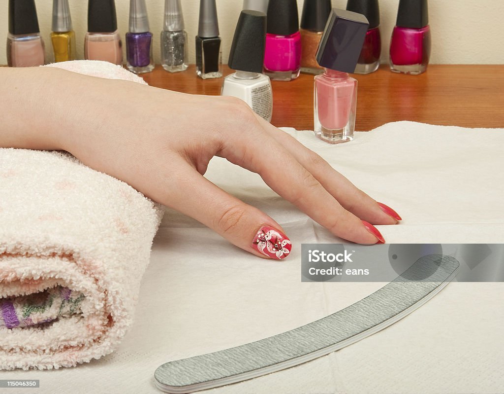 Woman hand on manicure table