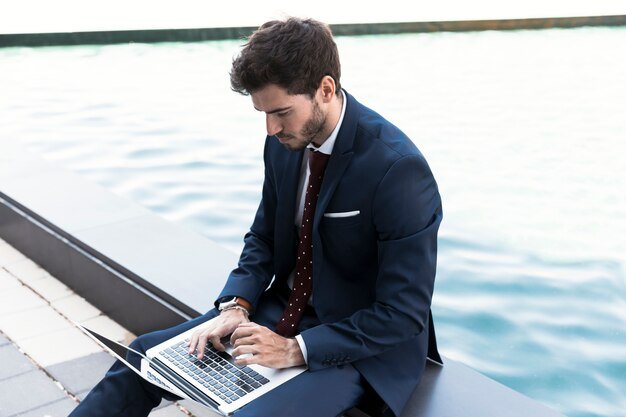 side-view-man-working-his-laptop_23-2148230754